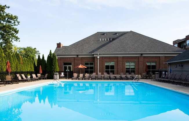 harrison park apartments outdoor pool with lounge chairs