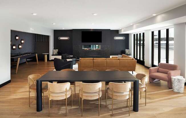 A black and gold dining table with chairs in a modern living room.