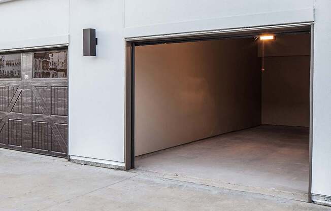 a garage door is open and the light is on