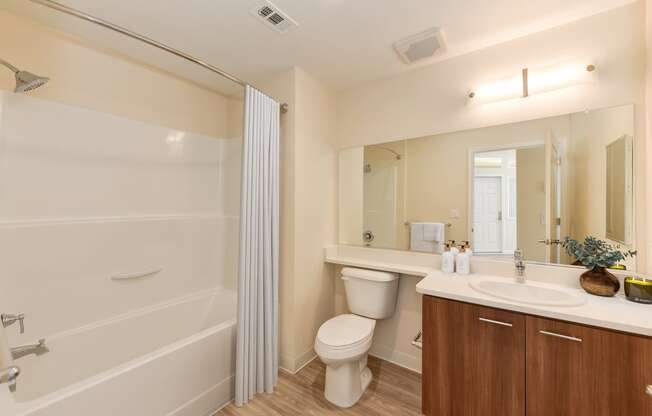 the preserve at ballantyne commons apartment bathroom with toilet sink and shower