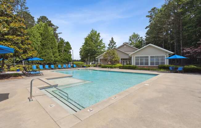 the preserve at ballantyne commons pool with house and trees