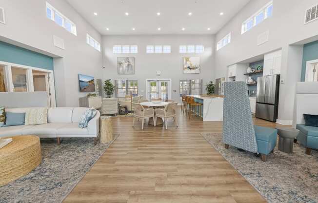 a living room with couches and a dining room with a table