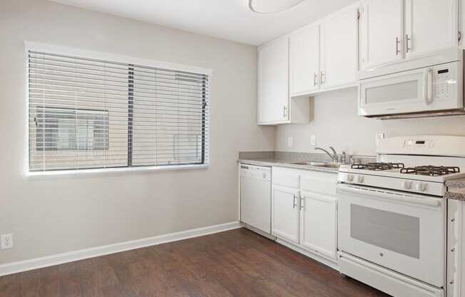 Kitchen With White Cabinetry And Appliances at Superior Place, Northridge, CA