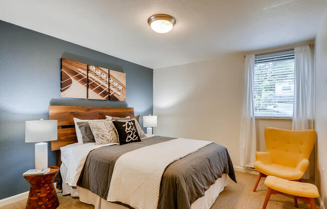 Three Bedroom Apartments in Happy Valley, OR - Sunnyside Village Apartments Large Bedroom with Carpet Flooring and Window
