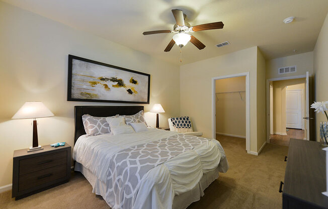 a bedroom with a bed and a ceiling fan  at Cabana Club - Galleria Club, Jacksonville, FL