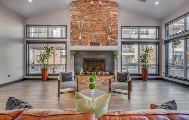 Large clubhouse with vaulted ceilings, pool table, sitting area, and fireplace