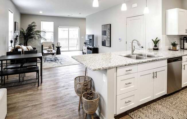 Two and three bedroom townhomes featuring golf course views, fill-size washer and dryer, stainless steel appliances, granite countertops, kitchen island, faux wood flooring and smart-home technology with keyless entry at Sandstone Villas in Omaha, NE