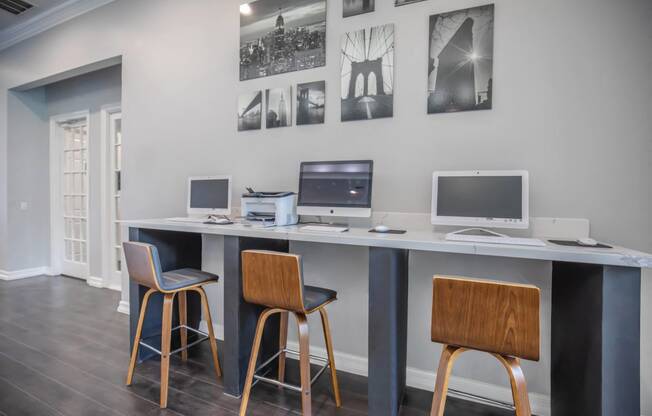 Apartments In Houston Texas for Rent – Westchase Forest - Photo of a long desk with three computers and three stools