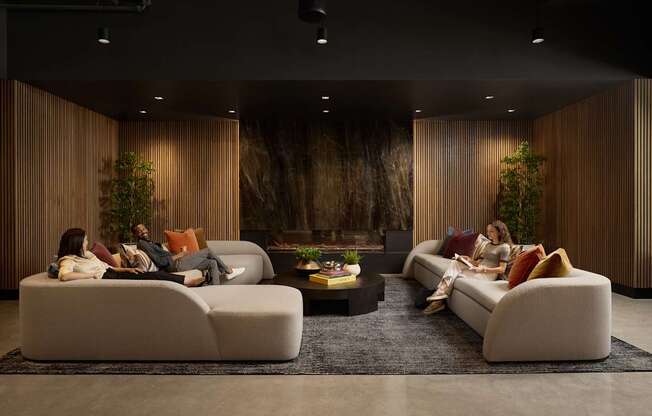 A modern living room with a large couch and a coffee table.