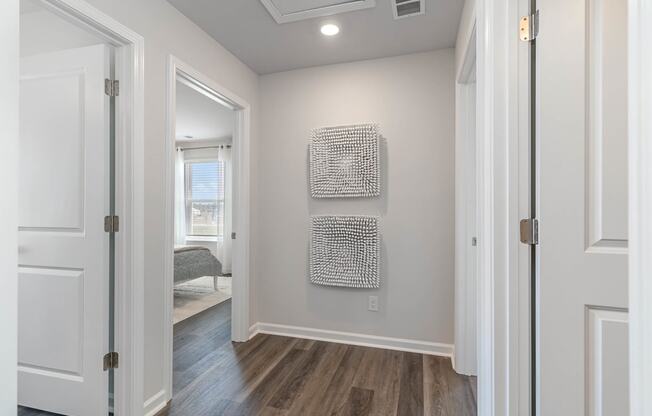 a bedroom with grey walls and a white ceiling