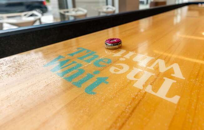 a wooden table with the big city painted on it