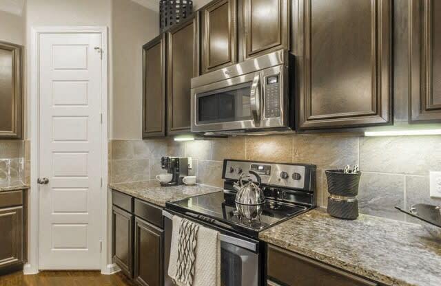 Kitchen With Ample Storage at Berkshire Woodland, Conroe, Texas