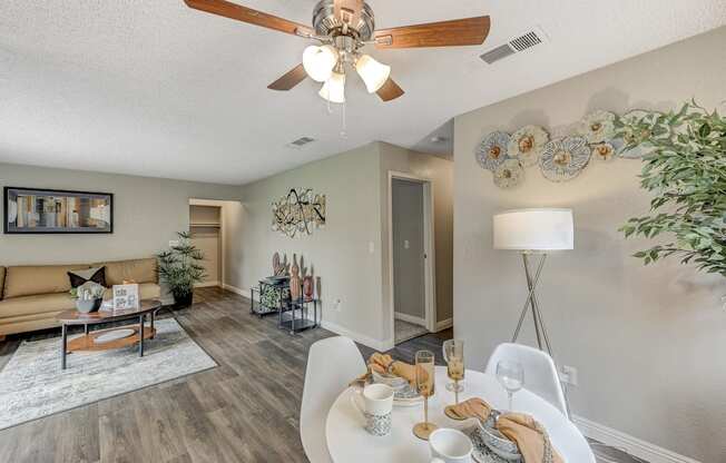 our living room and dining room are spacious and modern with a ceiling fan at Desert Bay Apartments, Laughlin,89029