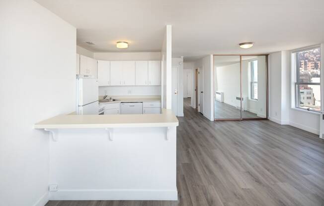 a kitchen and living room in a 555 waverly unit