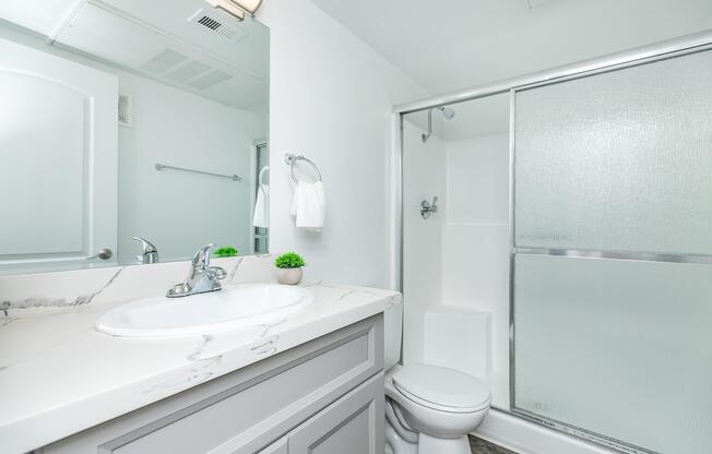 a room with a sink and a mirror