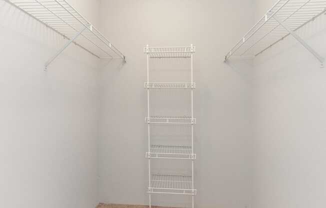 a white room with a ladder in the middle of it