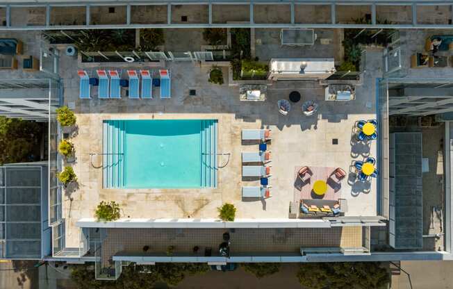 an aerial view of a pool on the roof of a building