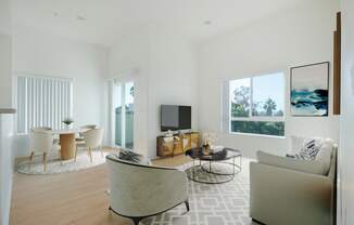 a living room with a couch and a table and a television