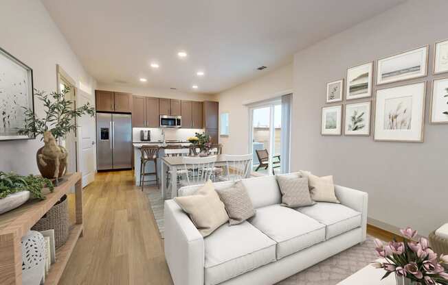 a living room with a couch and a table in a kitchen