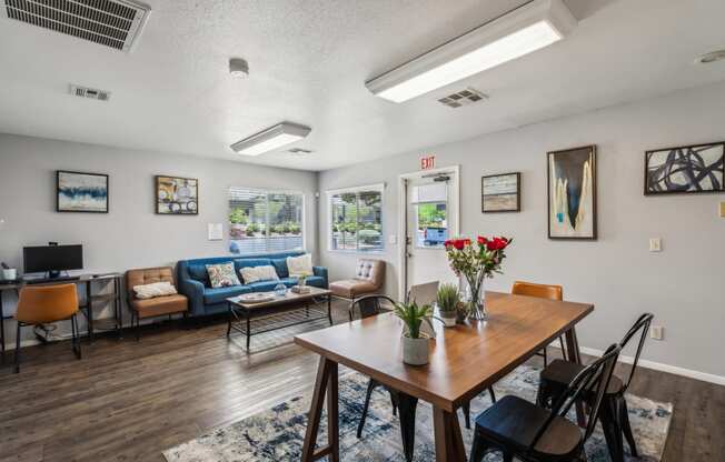 a dining room with a table and chairs and a living room with couches