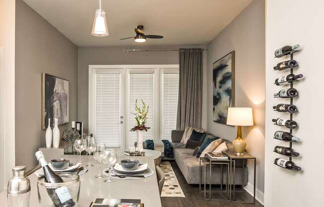 A well-lit dining area with a table set for a meal.