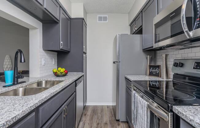 a large kitchen with stainless steel appliances