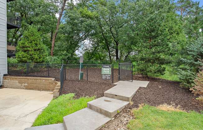 A park area with a sign and steps.
