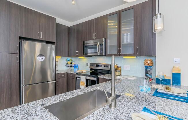 a modern kitchen with stainless steel appliances