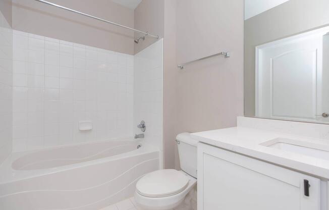 a room with a sink and a shower
