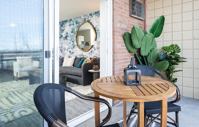 a small patio with a table and chairs at The Heights Apartments, Cincinnati, OH