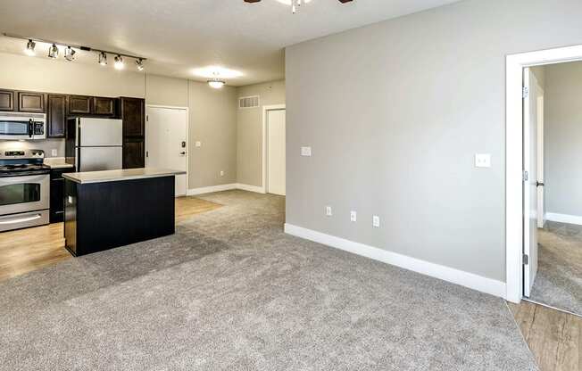 Beautiful Living Room with carpeted flooring at Tamarin Ridge in Lincoln, NE