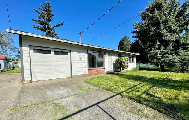 Updated Lents Charmer with Attached Garage~ New Flooring~ Large Fenced Yard & A/C