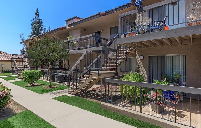 a house with a fence in front of a building