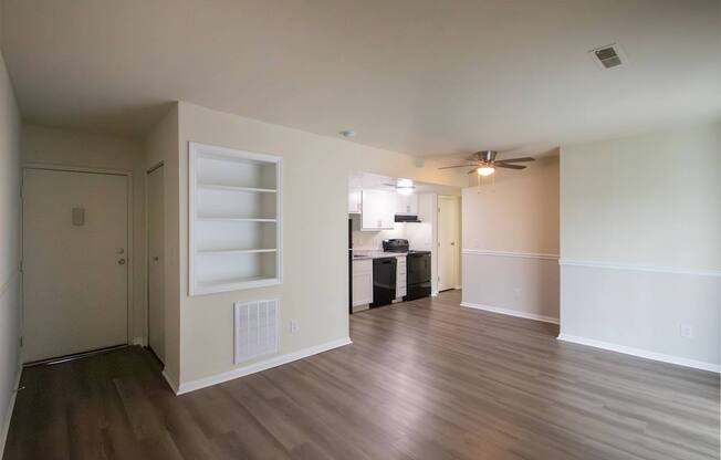 This is a photo of the living room with built-in bookshelf of the 560 square foot 1 bedroom, 1 bath Elm floor plan at Montana Valley Apartments in Cincinnati, OH.