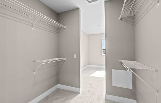 a spacious walk in closet in a 555 waverly unit