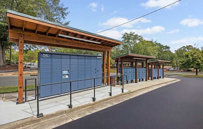 A bus stop with a shelter and a sign that says "Hub".