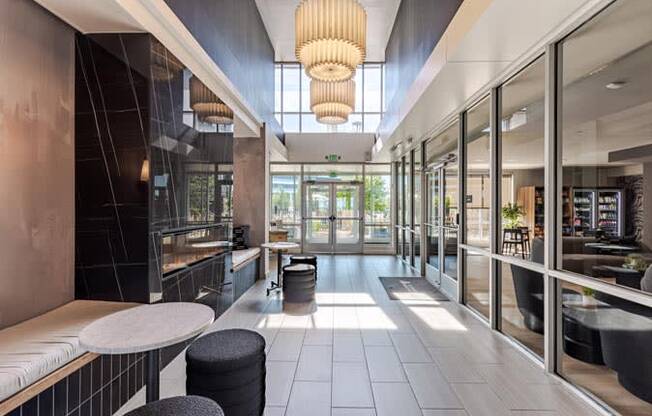 the lobby of a restaurant with tables and chairs