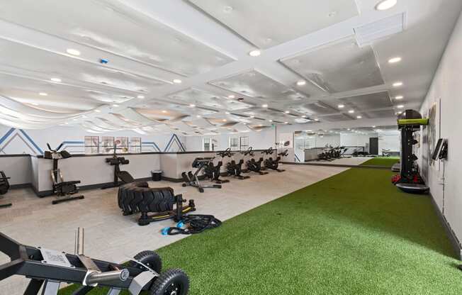 Gym with exercise equipment and a green carpet at Windsor Westminster, Westminster, Colorado