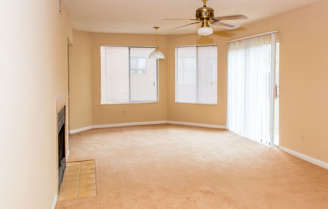 Living room with ceiling fan at Laurel Grove Apartment Homes, Orange Park, FL, 32073