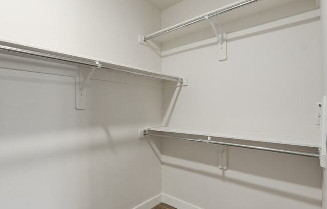 a spacious walk in closet in a 555 waverly unit at The Flats at Riverwoods, Utah