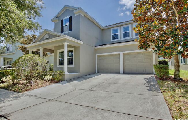 Gorgeous 4/3.5 Home with a Large Fenced Backyard in the Desirable Guard Gated Waters Edge Community at Lake Nona - Orlando!