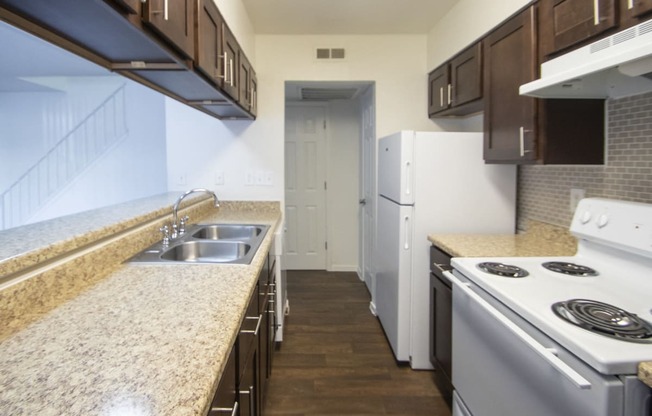 This is a photo of the kitchen of a fully upgraded 1084 square foot 2 bedroom townhome at The Biltmore Apartments in Dallas, TX.