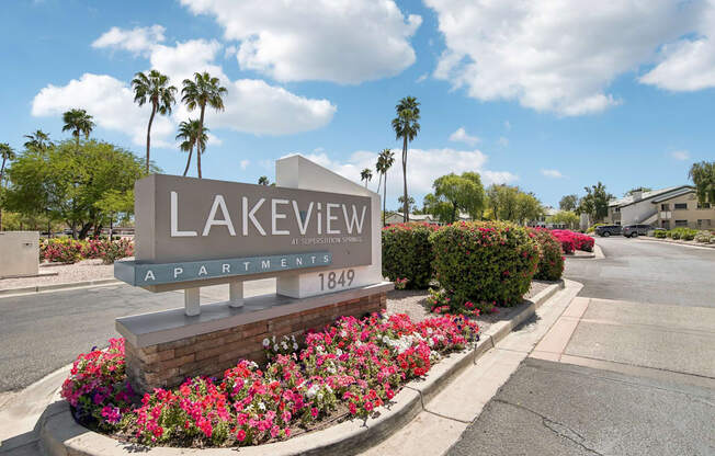 A sign for Lakeview Apartments with a phone number on it.