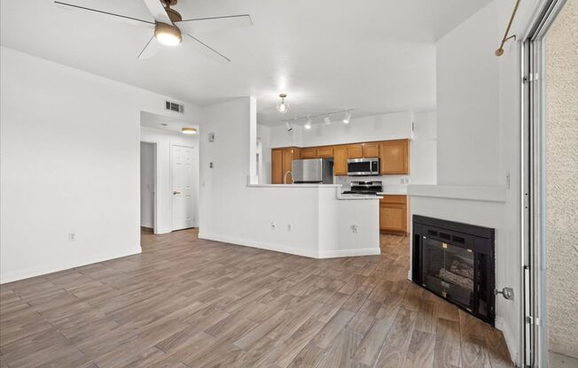 Charming 2-Bedroom First Floor Featuring Open Layout, Fireplace, Patio & Community Pool