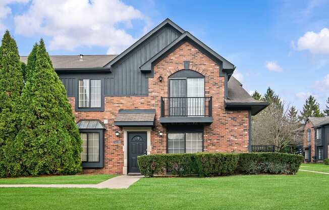 A large house with a black door and windows.