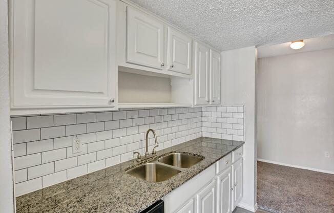 a kitchen with a sink and a window