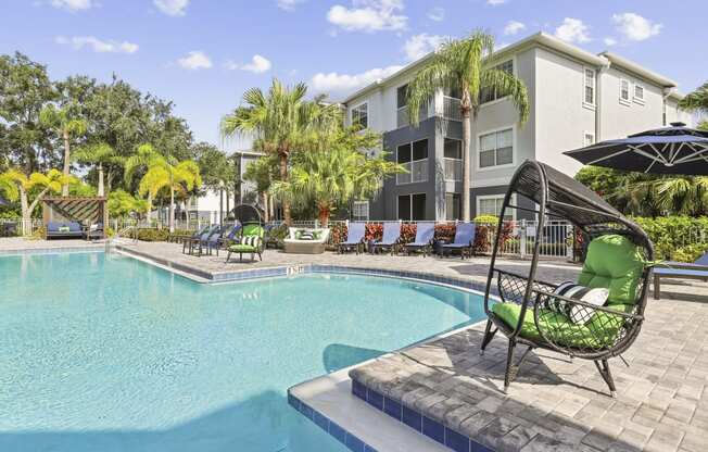 our apartments have a large swimming pool with lounge chairs and umbrellas