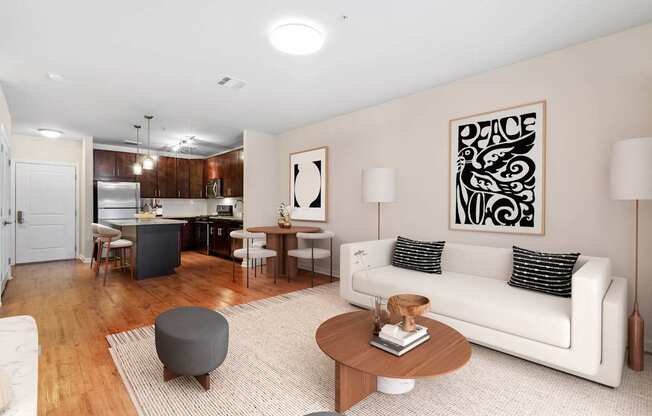 A living room with a white couch and a coffee table at Metro 303, Hempstead, NY, 11550