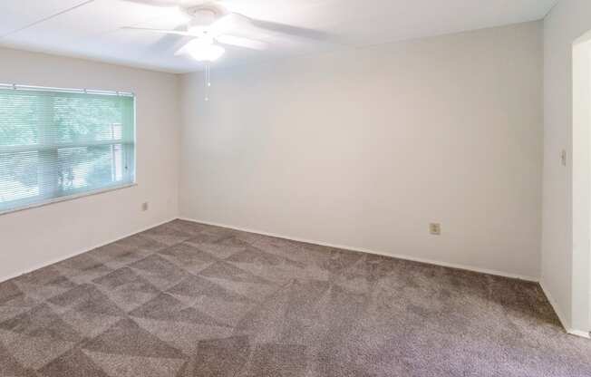 This is a photo of the bedroom of the 550 square foot 1 bedroom, 1 bath patio apartment at College Woods Apartments in the North College Hill neighborhood of Cincinnati, OH.