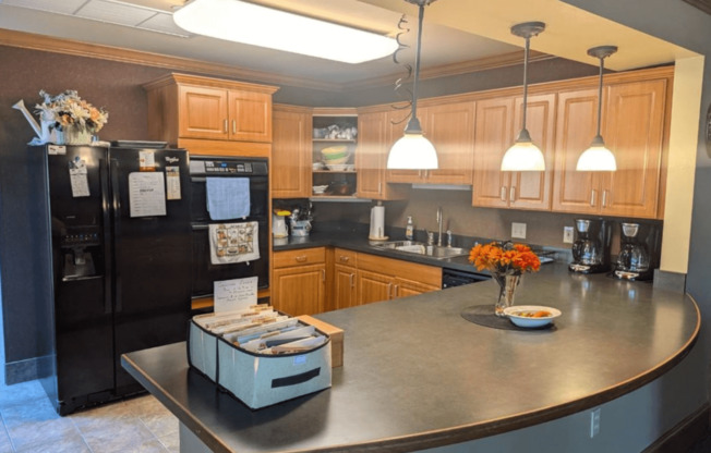 a kitchen with a counter top and a refrigerator